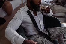 Load image into Gallery viewer, Beautiful Black man with a beard in the NIGHTCAP luxury scented candle campaign for HAUME. Notes of citrus, amber and musk.
